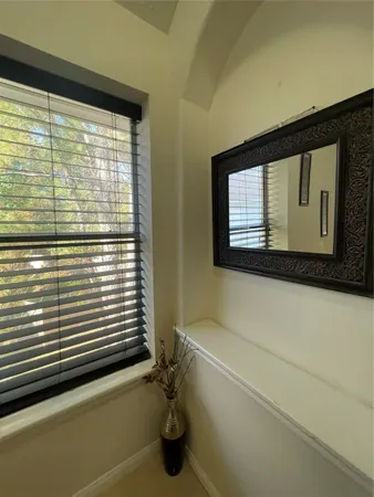 a bathroom with a bathtub and a window