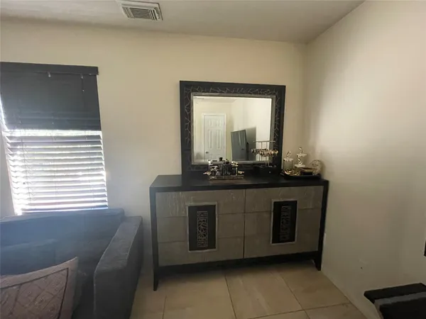 a room with a sink and a mirror