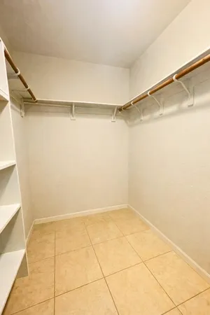 a view of a room with an empty walk in closet