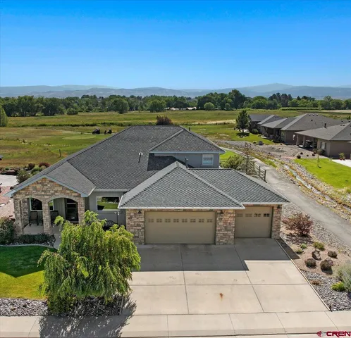 a view of residential houses with outdoor space and ocean view