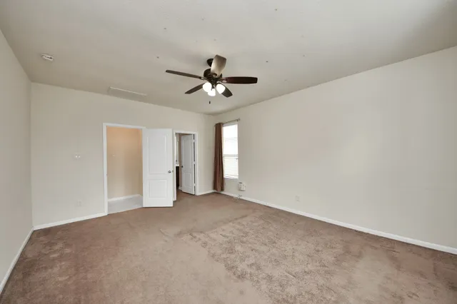 a view of a big room with carpet