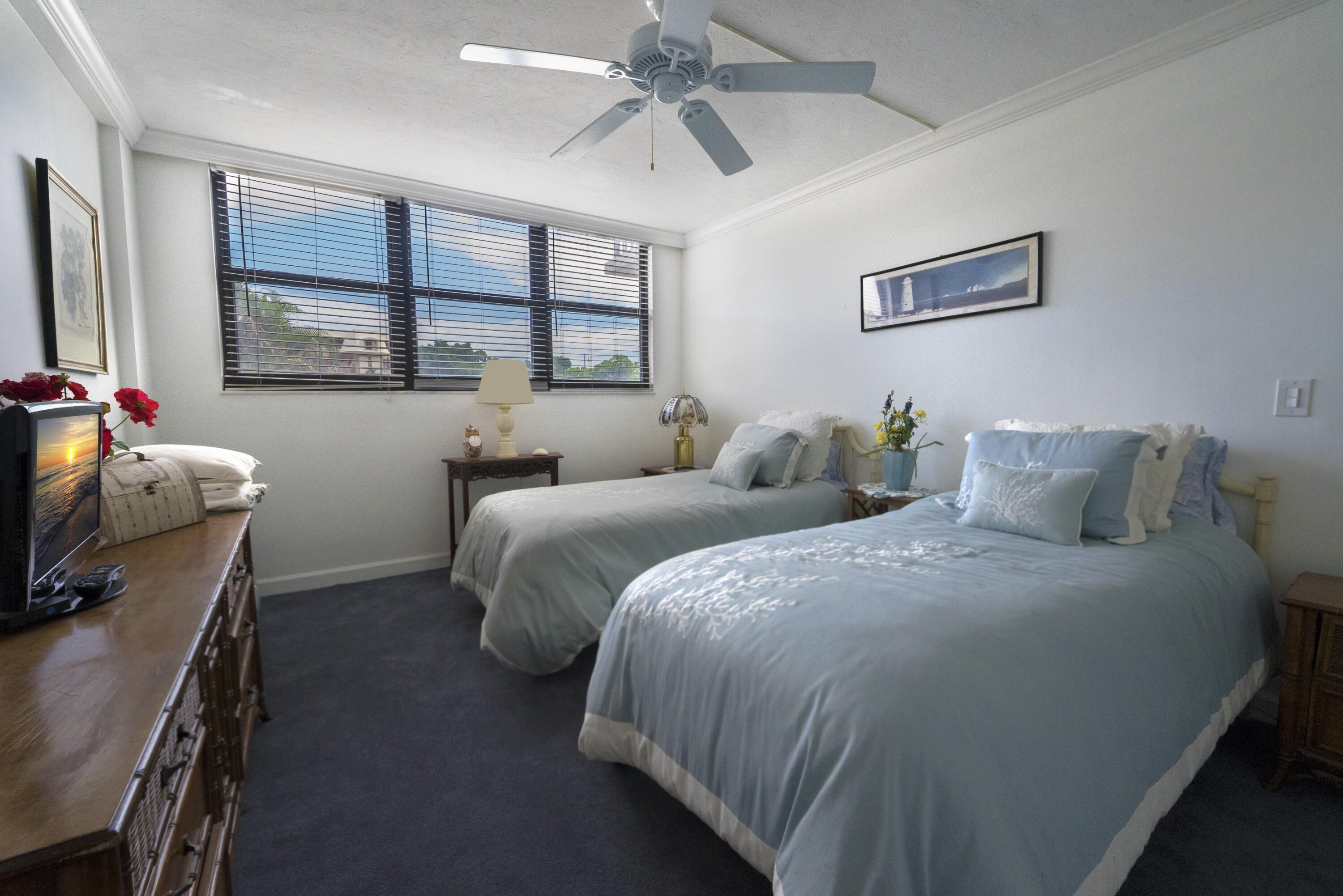 336 Golfview Road, Unit 203 North Palm Beach, FL 33408 - Photo 15 of 43 a bedroom with two beds and a window