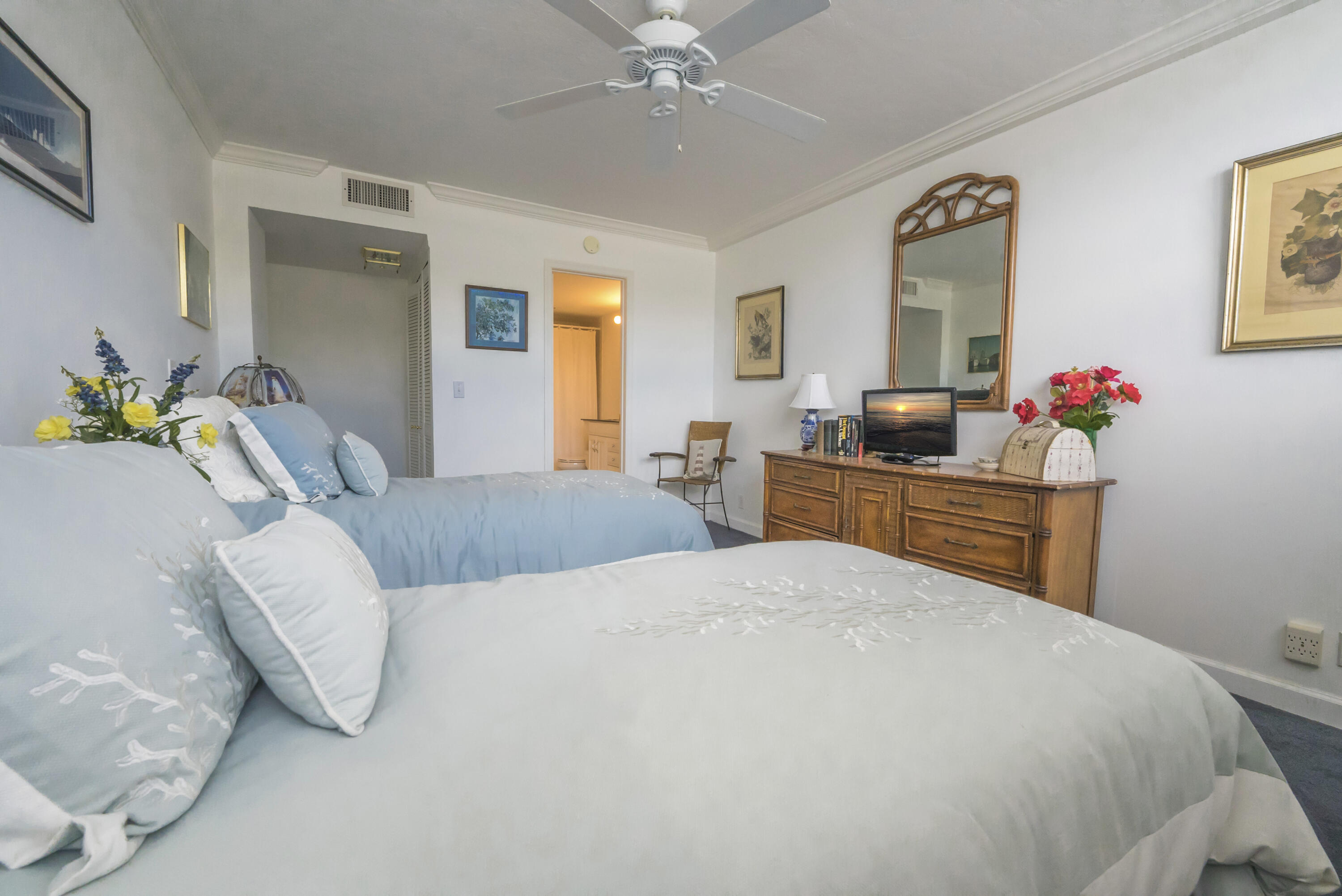 336 Golfview Road, Unit 203 North Palm Beach, FL 33408 - Photo 17 of 43 a bedroom with a bed dresser and window