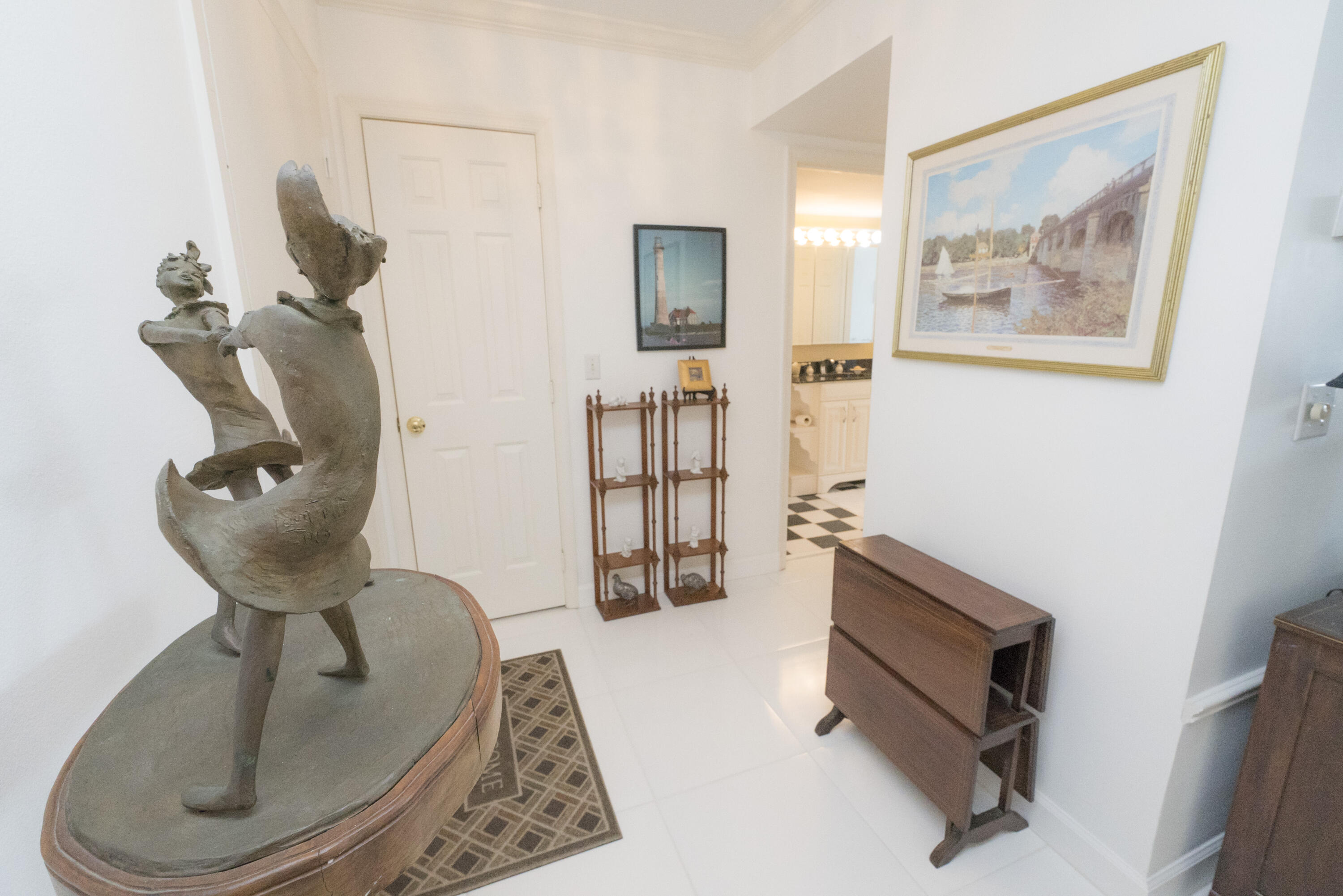 336 Golfview Road, Unit 203 North Palm Beach, FL 33408 - Photo 20 of 43 a room with painting on the wall and a window