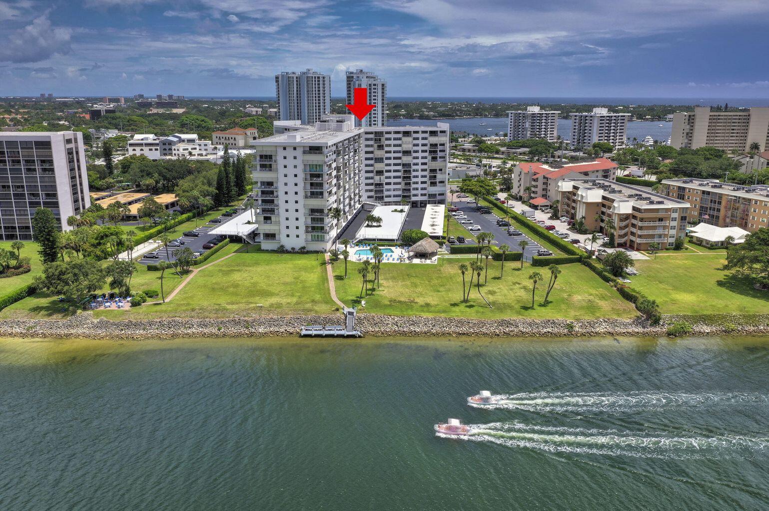 336 Golfview Road, Unit 203 North Palm Beach, FL 33408 - Photo 5 of 43 a view of a house with a swimming pool