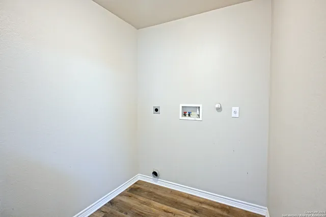 a view of a small space with wooden floor