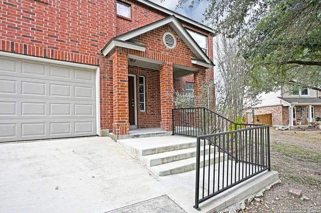 a view of a house with a iron gate