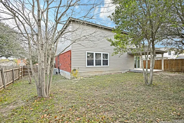a house view with a backyard space
