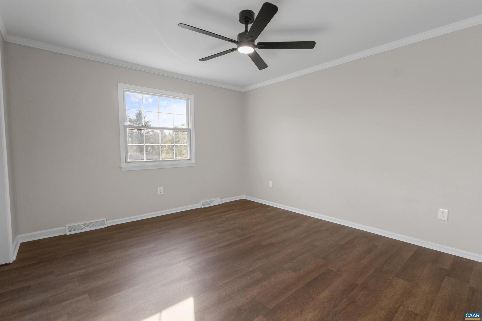 3053 Woodway Road Roanoke, VA 24014 - Photo 13 of 33 an empty room with wooden floor fan and windows