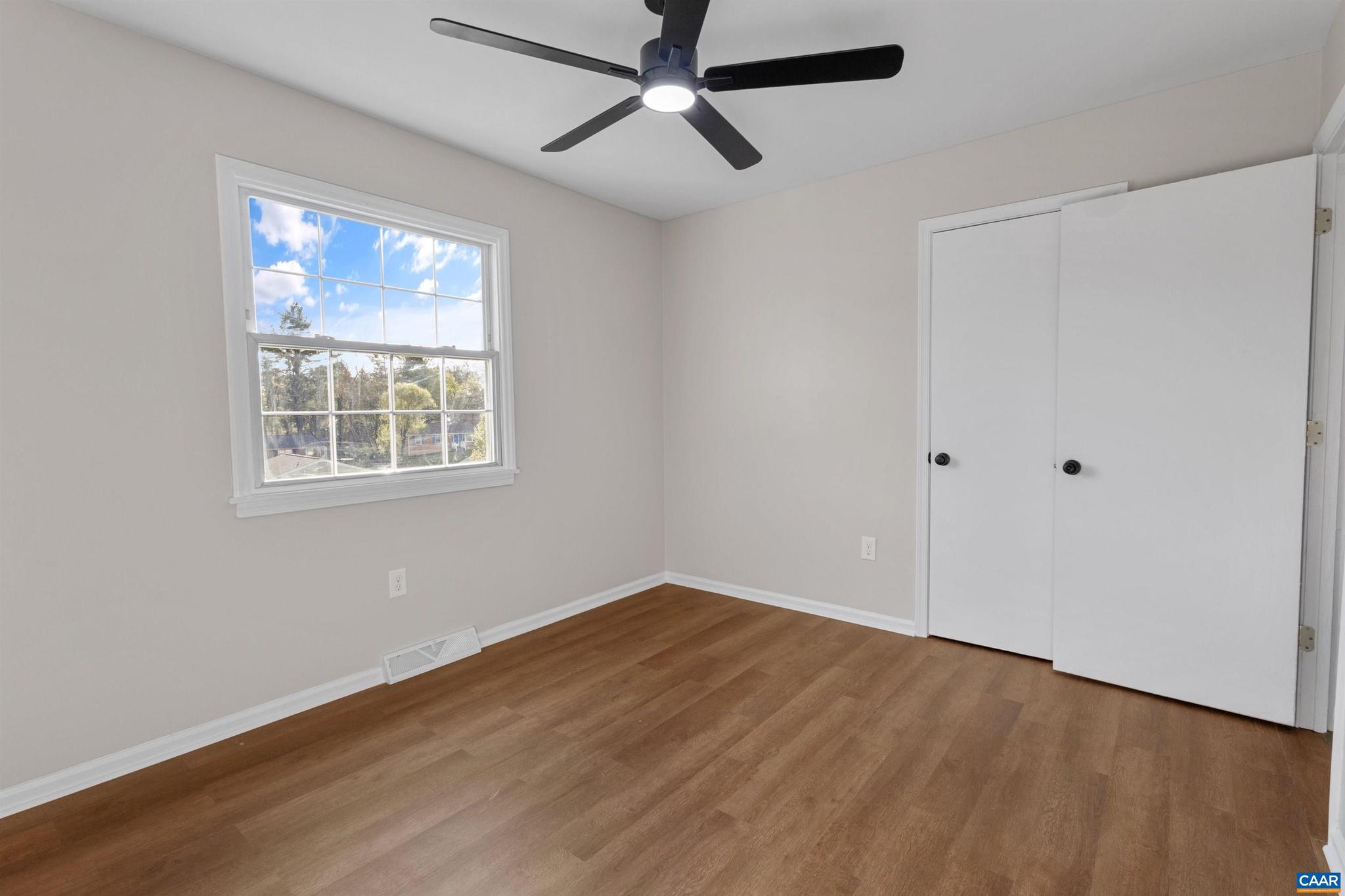3053 Woodway Road Roanoke, VA 24014 - Photo 15 of 33 a view of empty room with wooden floor and fan