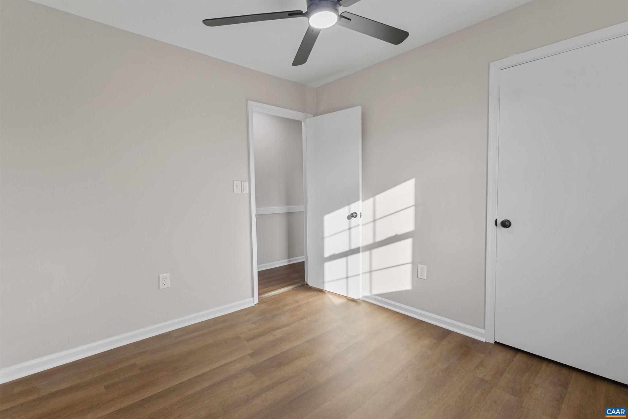 3053 Woodway Road Roanoke, VA 24014 - Photo 19 of 33 an empty room with wooden floor cabinet and windows