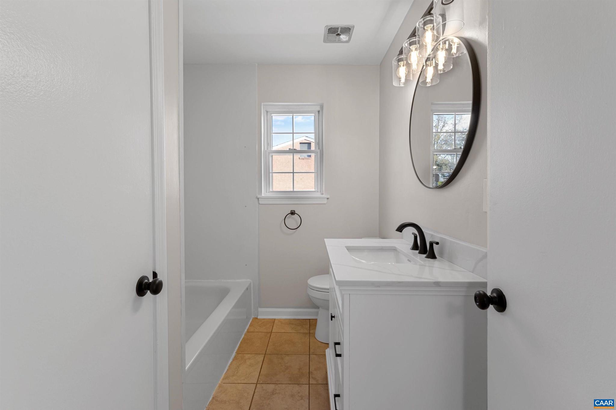 3053 Woodway Road Roanoke, VA 24014 - Photo 21 of 33 a bathroom with a sink and a mirror