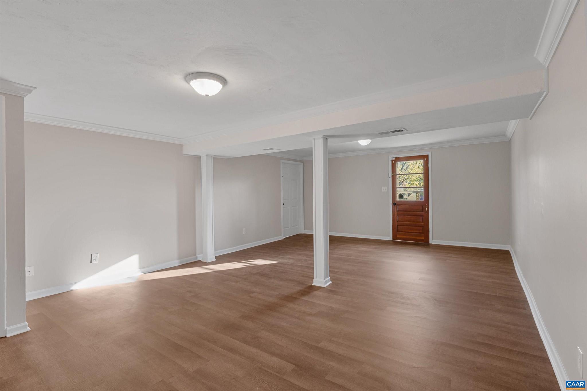 3053 Woodway Road Roanoke, VA 24014 - Photo 25 of 33 an empty room with wooden floor and windows