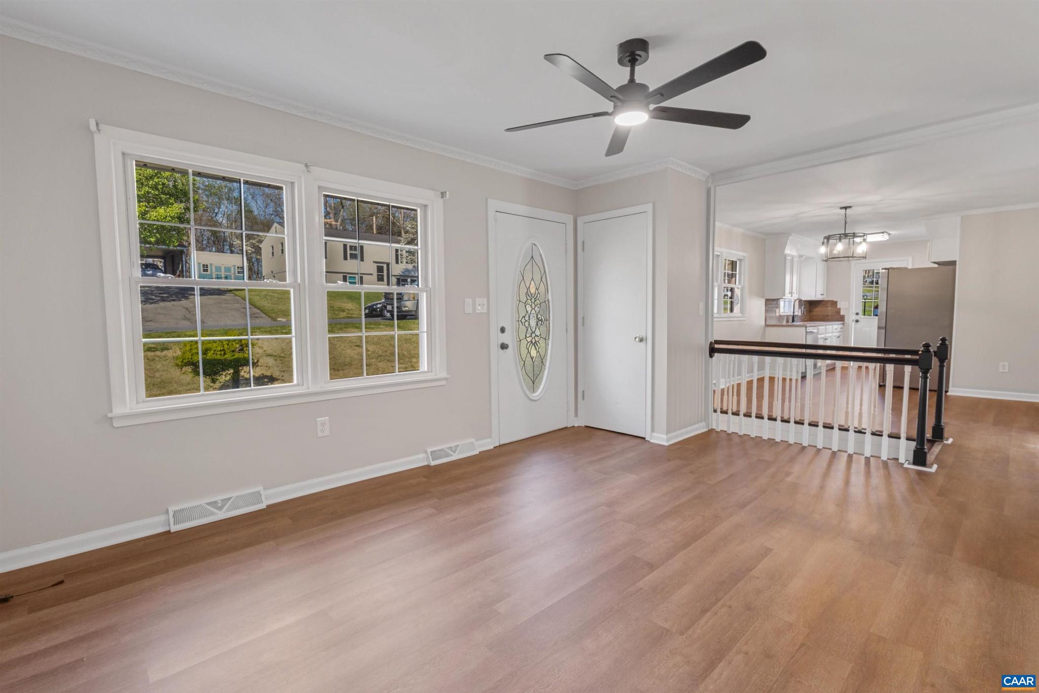 3053 Woodway Road Roanoke, VA 24014 - Photo 7 of 33 wooden floor in an empty room with a window