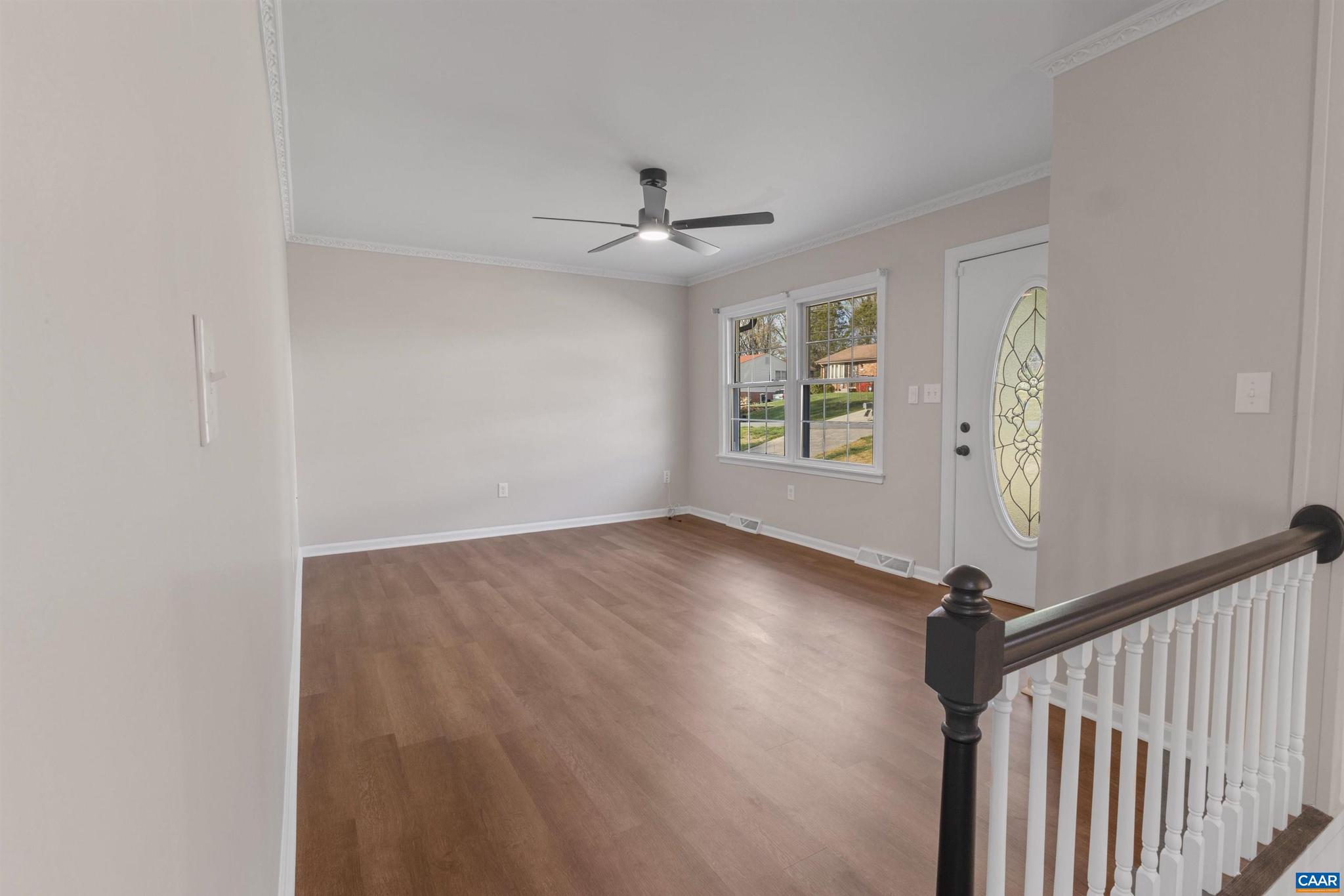 3053 Woodway Road Roanoke, VA 24014 - Photo 8 of 33 wooden floor in an empty room with a window
