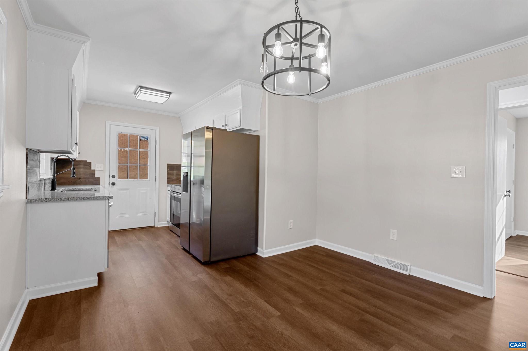3053 Woodway Road Roanoke, VA 24014 - Photo 10 of 33 a kitchen with a refrigerator and wooden floor
