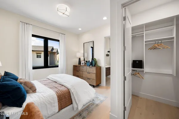 a bedroom with a bed and a walk in closet