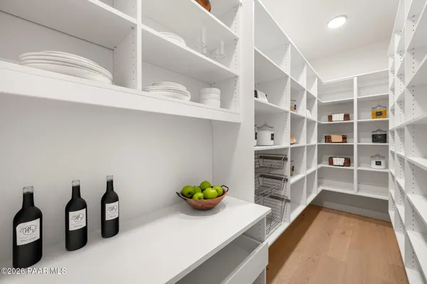 a view of a living room and shelves
