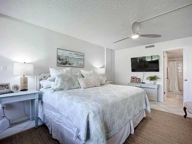 a bathroom with a toilet and shower