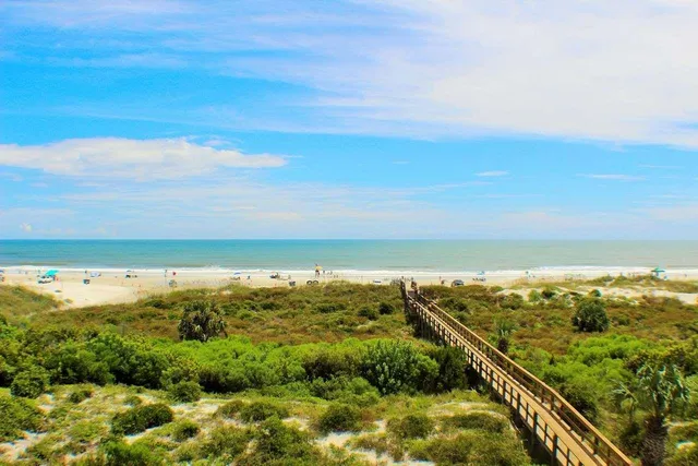 a view of a swimming pool with a yard