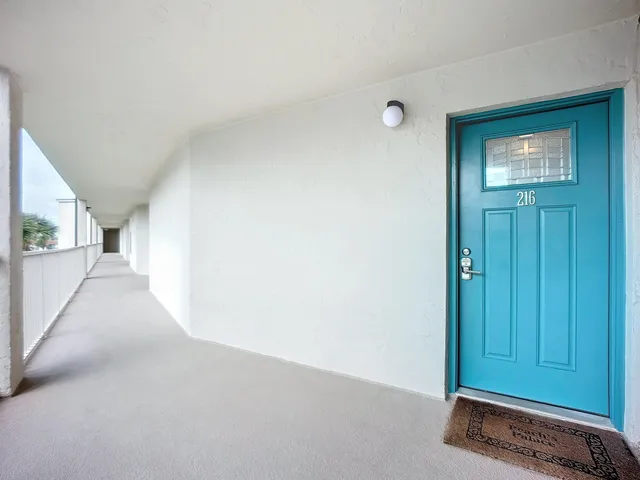 a kitchen that has a sink and a stove in it