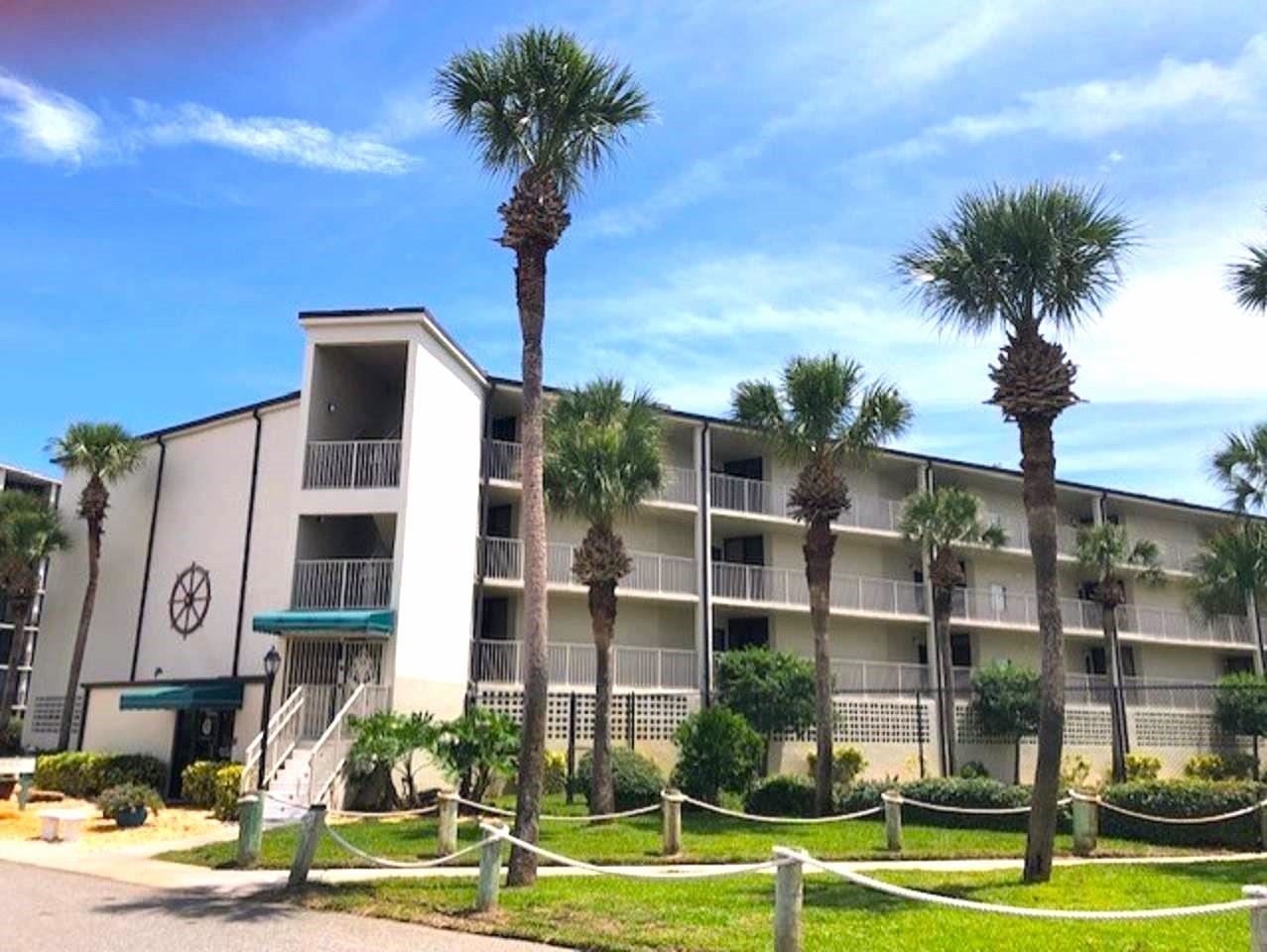 1 Dondanville Road, Unit 216C St. Augustine, FL 32080 - Photo 57 of 58 a front view of a building with street view