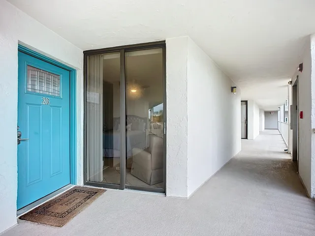 a kitchen with a sink cabinets and appliances