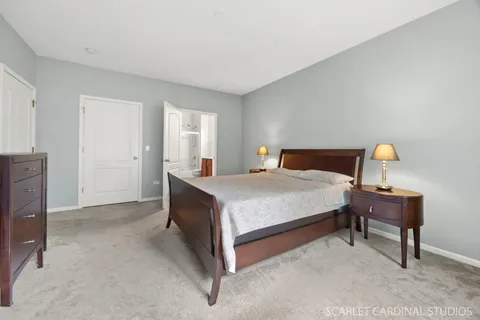 a bedroom with a bed and a table