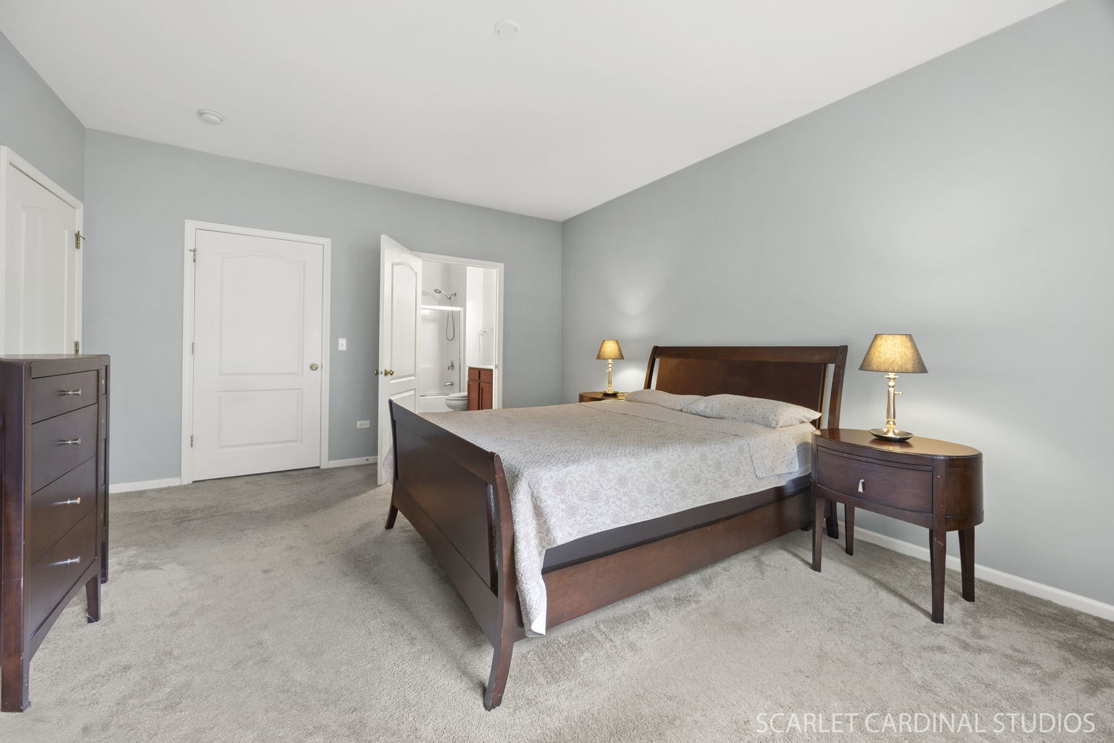 1275 West Lake Street, Unit 104 Addison, IL 60101 - Photo 13 of 20 a bedroom with a bed and a table
