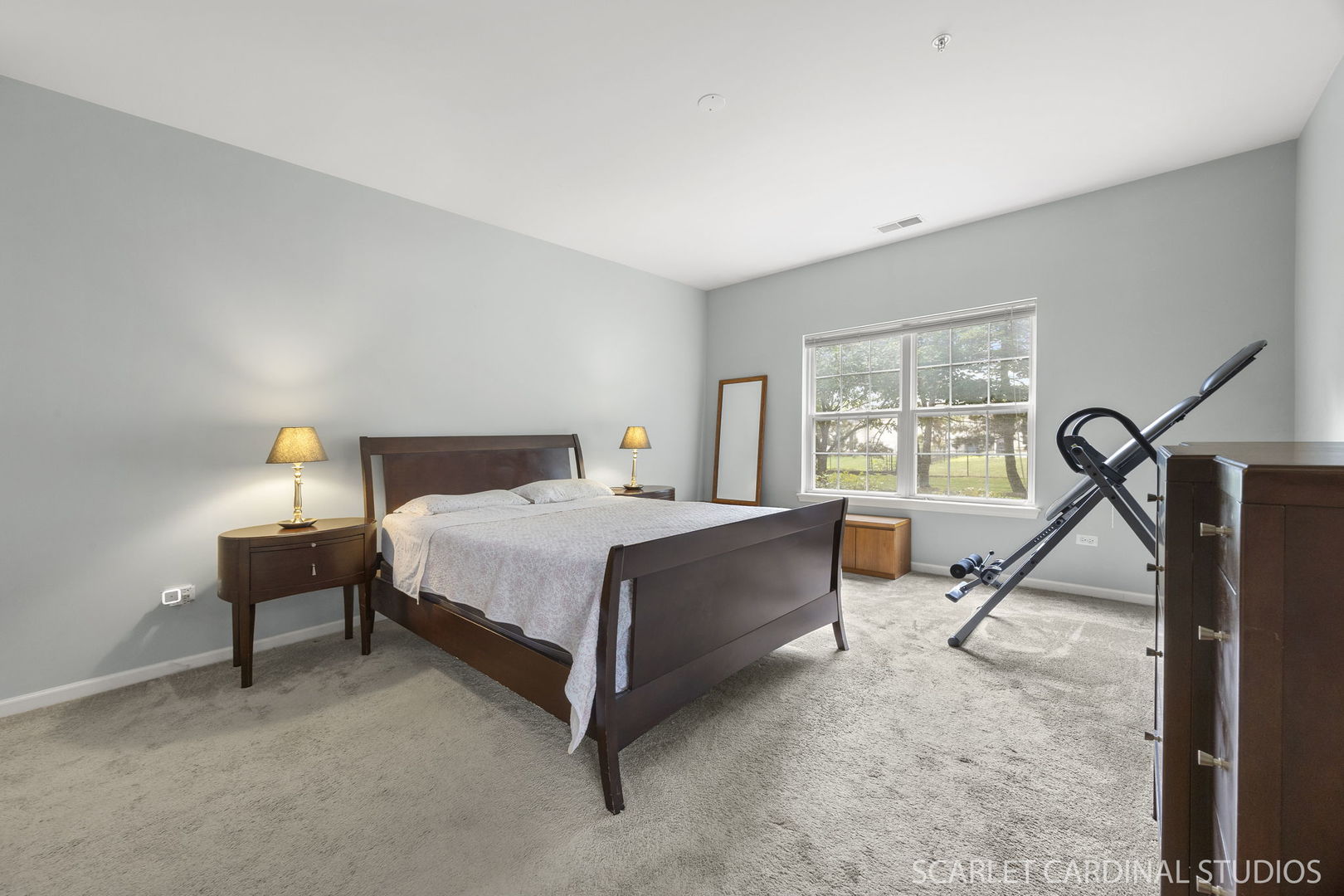 1275 West Lake Street, Unit 104 Addison, IL 60101 - Photo 14 of 20 a bedroom with a bed and a table in it