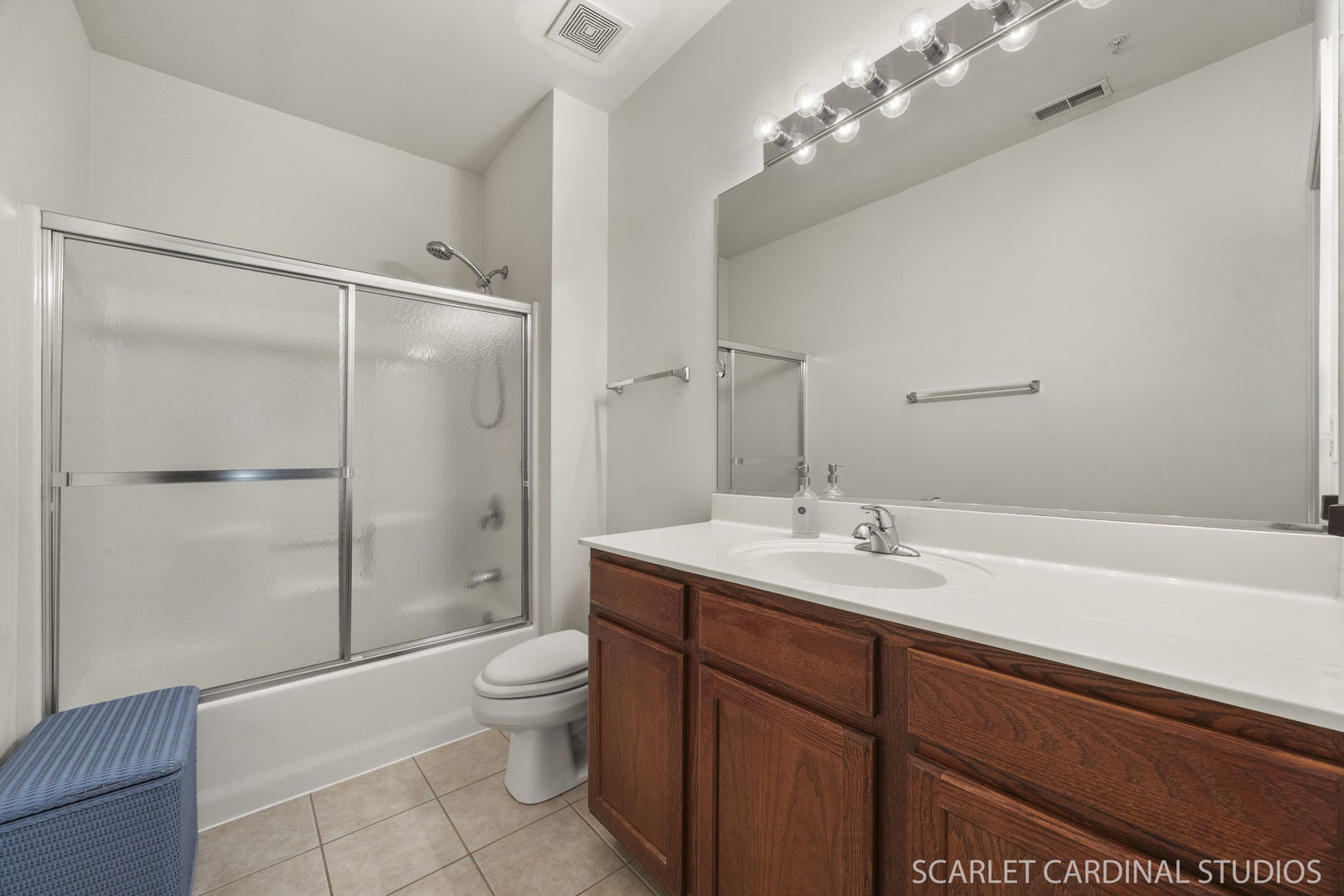 1275 West Lake Street, Unit 104 Addison, IL 60101 - Photo 15 of 20 a bathroom with a sink a toilet and shower