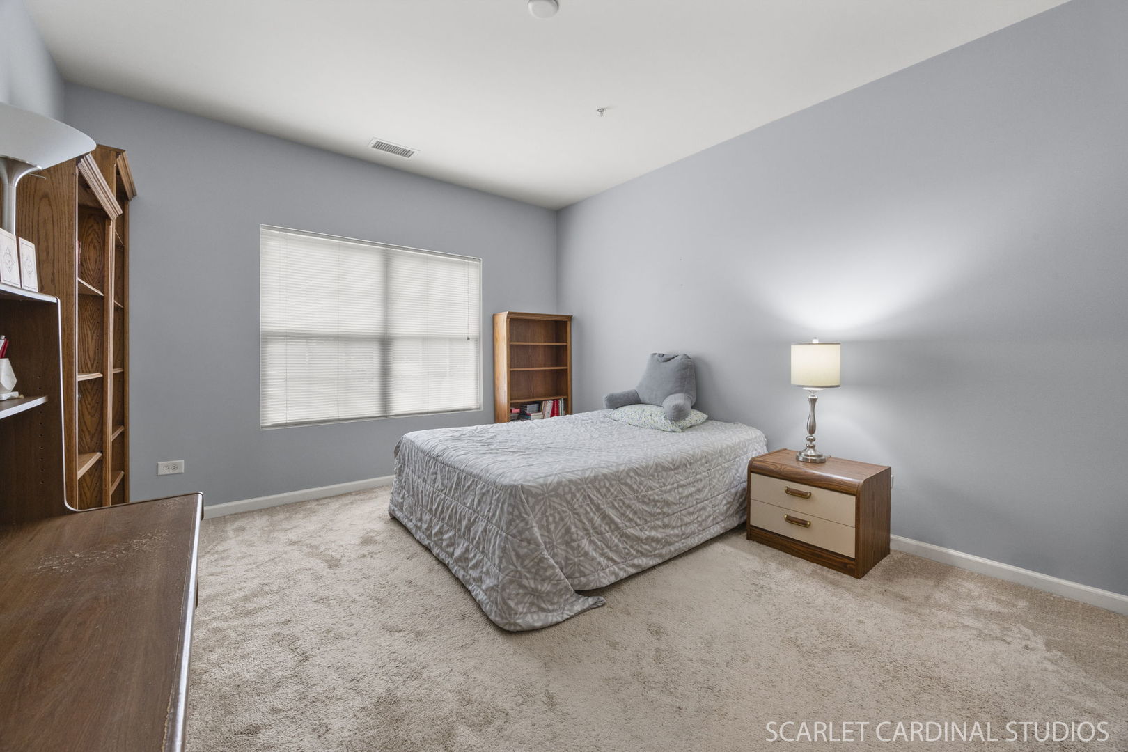 1275 West Lake Street, Unit 104 Addison, IL 60101 - Photo 16 of 20 a bedroom with a bed and a window