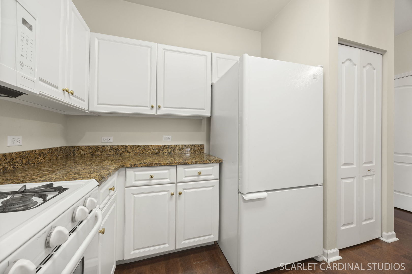 1275 West Lake Street, Unit 104 Addison, IL 60101 - Photo 8 of 20 a kitchen with a white cabinets and a stove