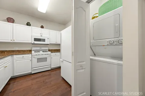 a kitchen with cabinets stainless steel appliances and sink