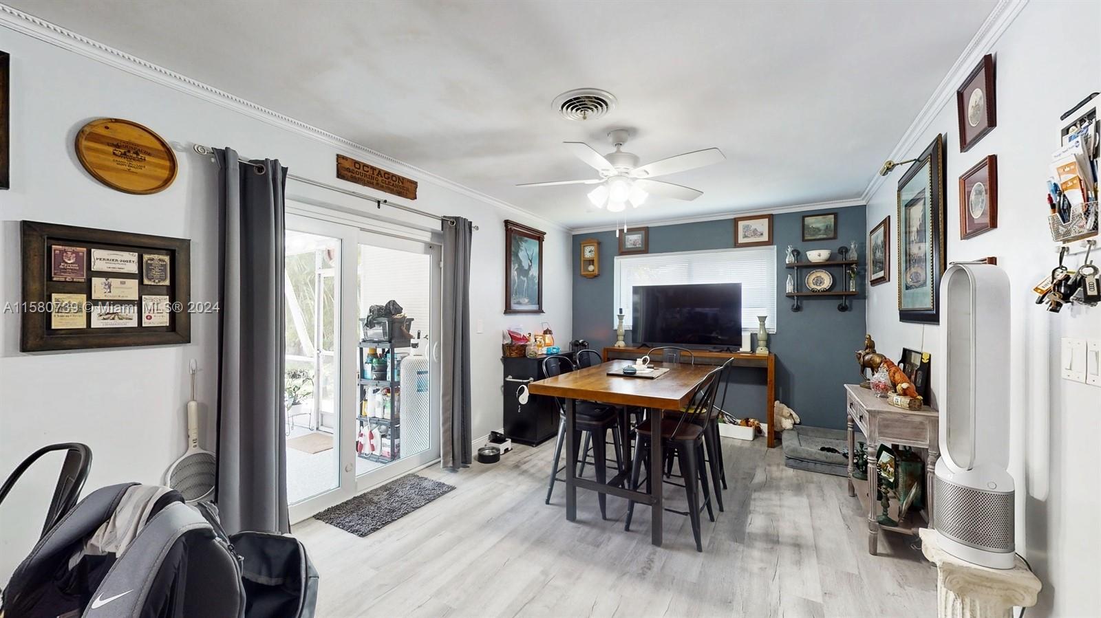 5424 Harrison Street Hollywood, FL 33021 - Photo 17 of 27 a view of a livingroom with furniture and a flat screen tv
