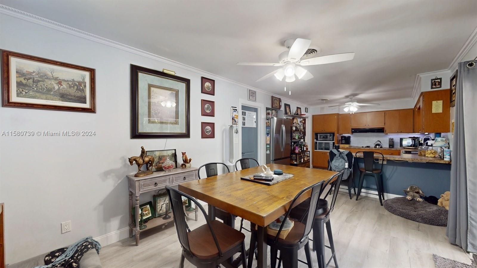 5424 Harrison Street Hollywood, FL 33021 - Photo 20 of 27 a view of a dining room with furniture