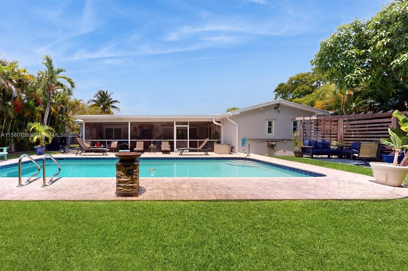 5424 Harrison Street Hollywood, FL 33021 - Photo 23 of 27 a view of house with a big yard and potted plants