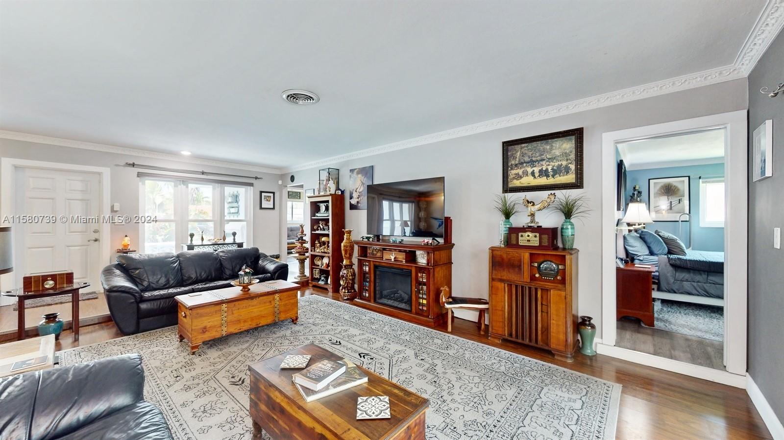 5424 Harrison Street Hollywood, FL 33021 - Photo 5 of 27 a living room with furniture and a couch