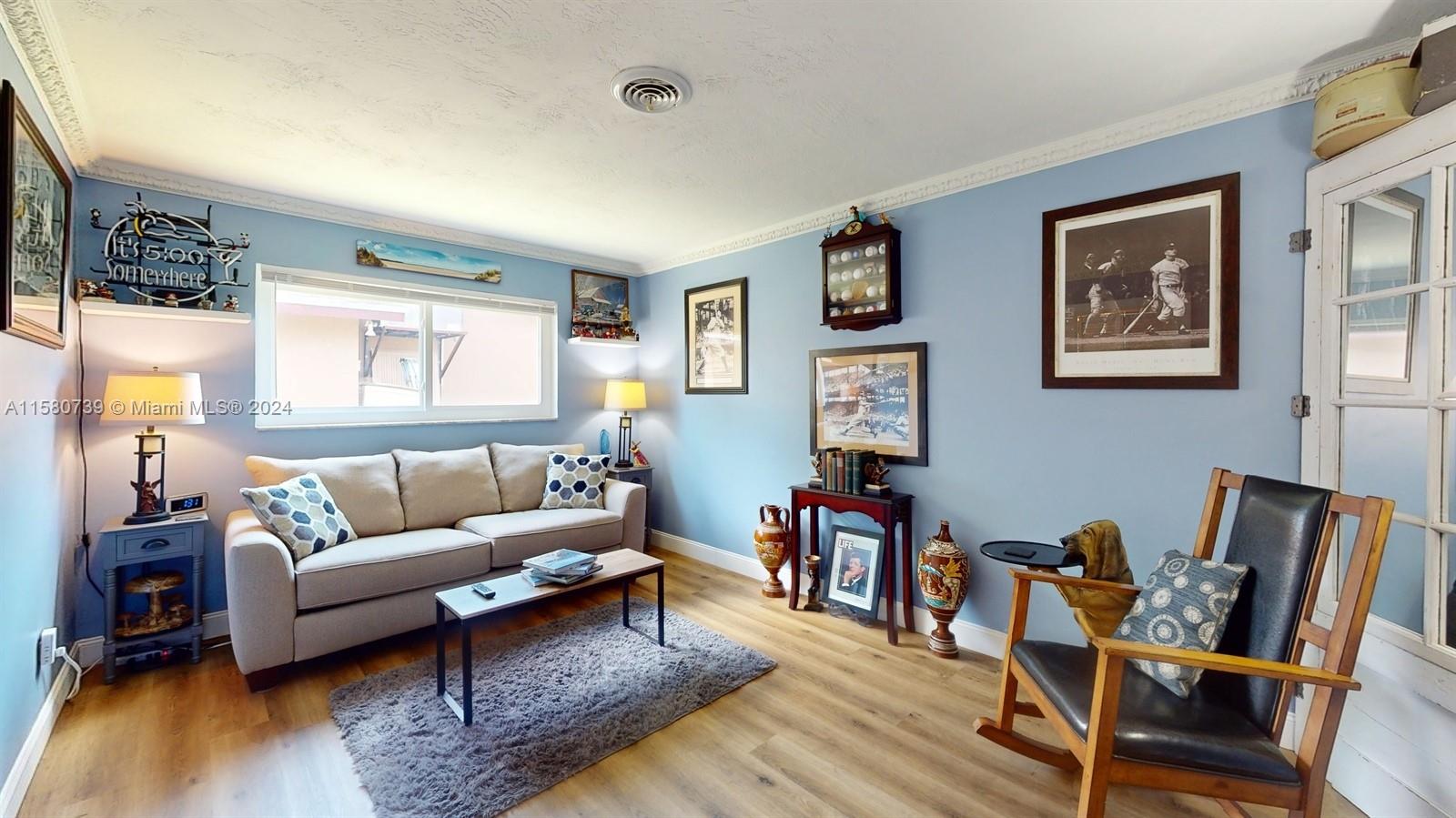 5424 Harrison Street Hollywood, FL 33021 - Photo 6 of 27 a living room with furniture and a wooden floor