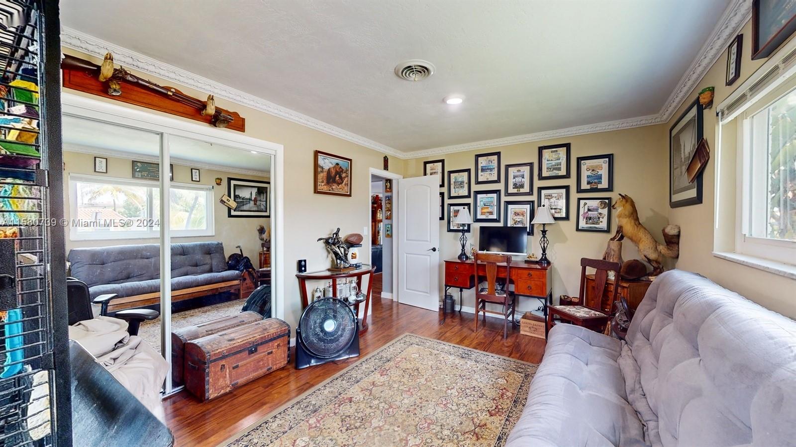 5424 Harrison Street Hollywood, FL 33021 - Photo 8 of 27 a living room with furniture a rug and a large window