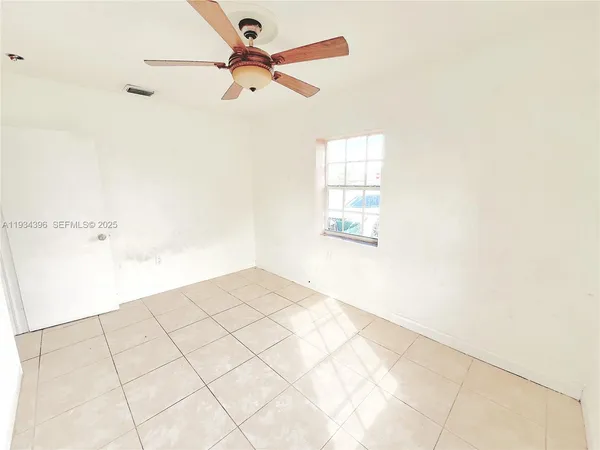 a white toilet sitting next to a bath tub