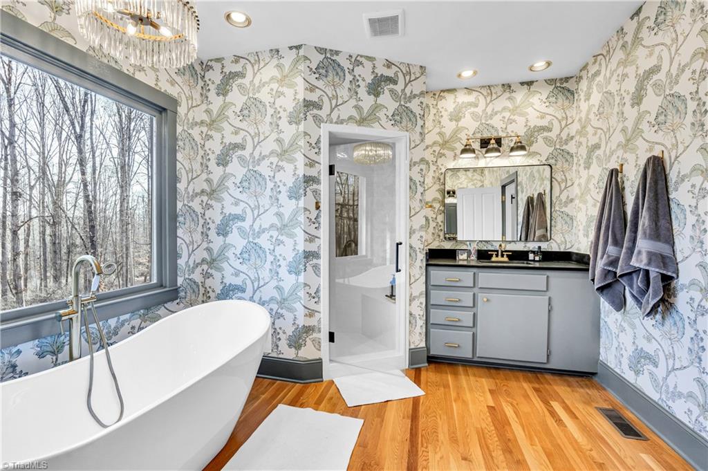 7042 Brookbank Road Summerfield, NC 27358 - Photo 23 of 50 A gorgeous primary bathroom space.