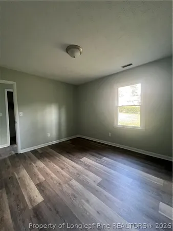 a view of a large body of water with a building in the background