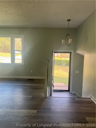 a view of an empty room and window