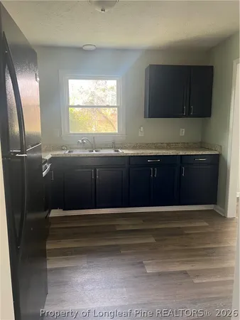 a view of entryway with kitchen