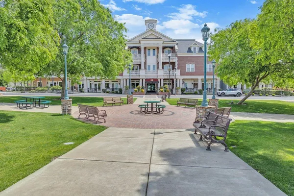 a view of brick building with a yard