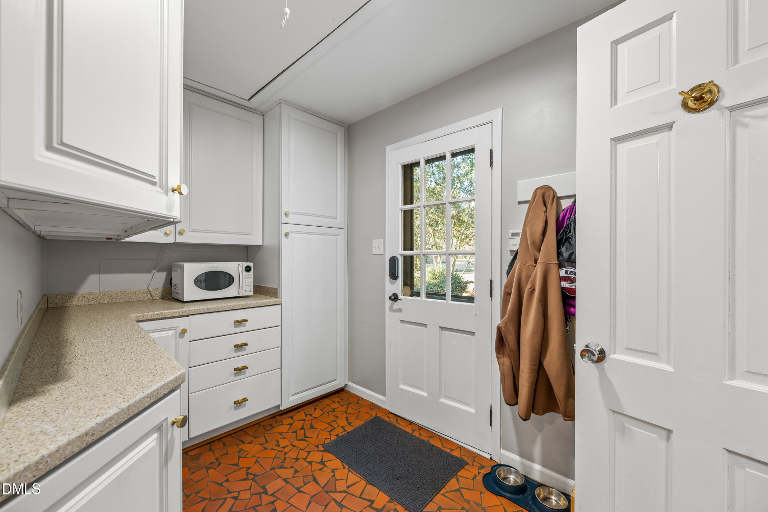 3726 Swift Drive Raleigh, NC 27606 - Photo 16 of 40 a view of a kitchen with storage and utility