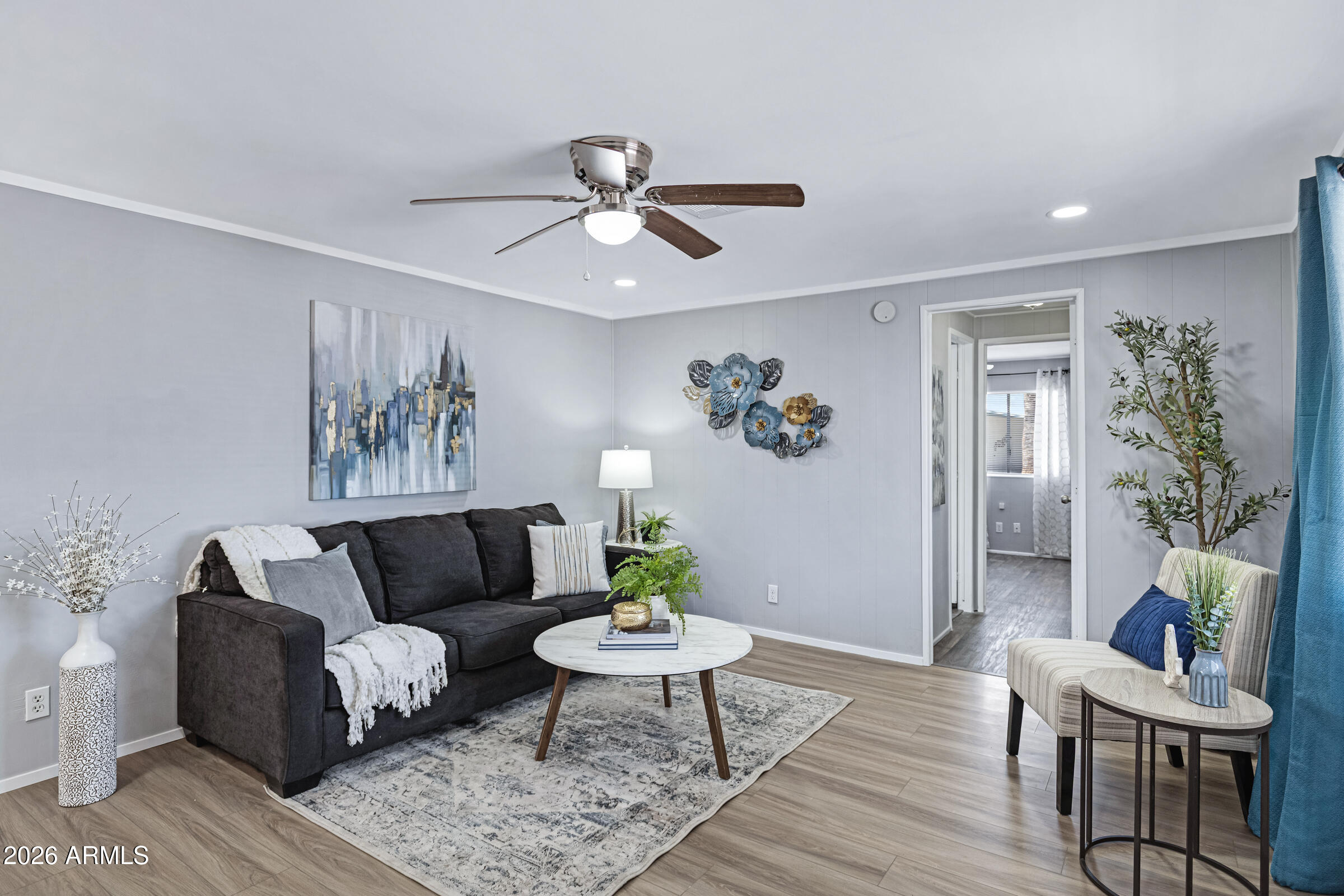 201 South Greenfield Road, Unit 269 Mesa, AZ 85206 - Photo 1 of 18 a living room with furniture and wooden floor