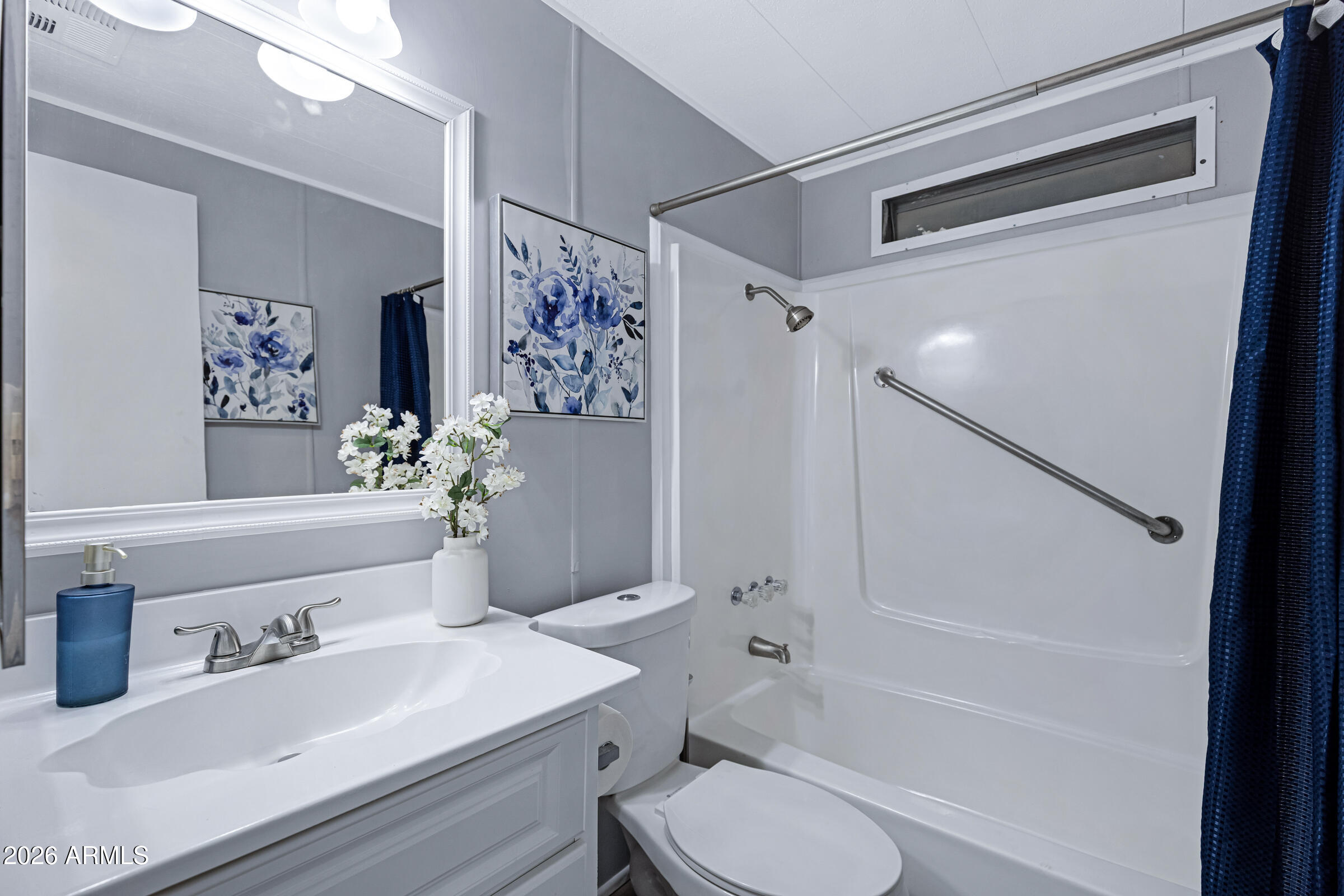 201 South Greenfield Road, Unit 269 Mesa, AZ 85206 - Photo 12 of 18 a bathroom with a sink toilet and shower