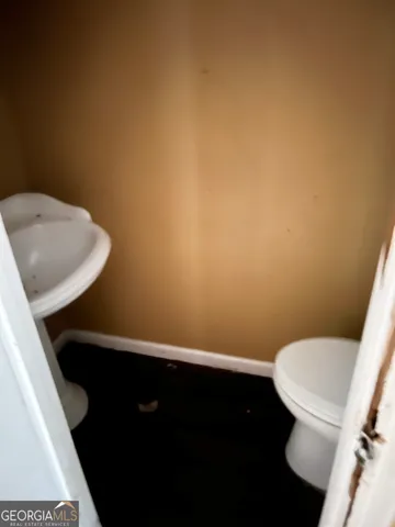 a bathroom with a toilet and a sink